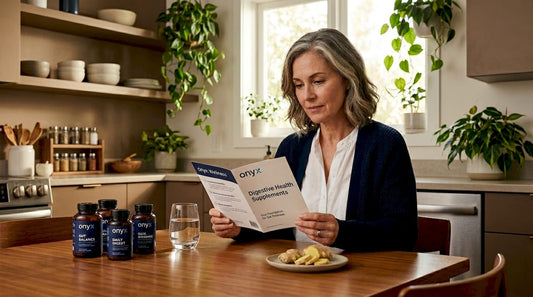Woman reading about digestive supplements at kitchen table
