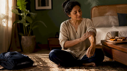 Woman performing Ayurvedic self-care indoors