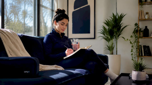 Woman practicing daily recovery rituals at home