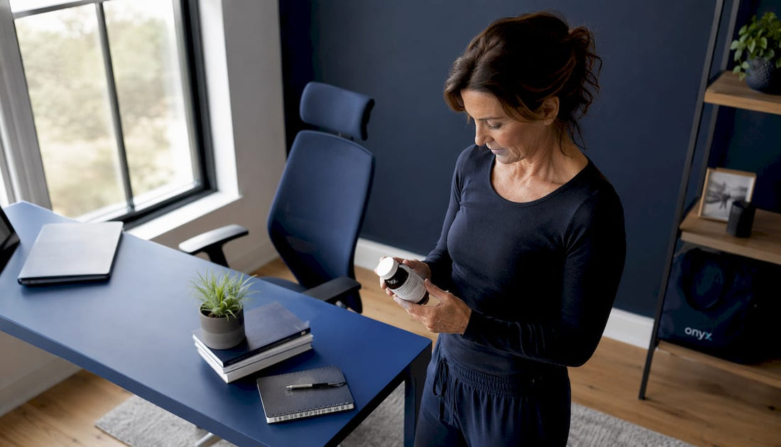 Woman reading cinnamon chromium supplement label in kitchen