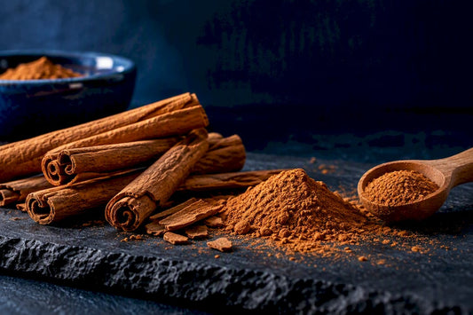 Cinnamon bark and ground cinnamon on slate